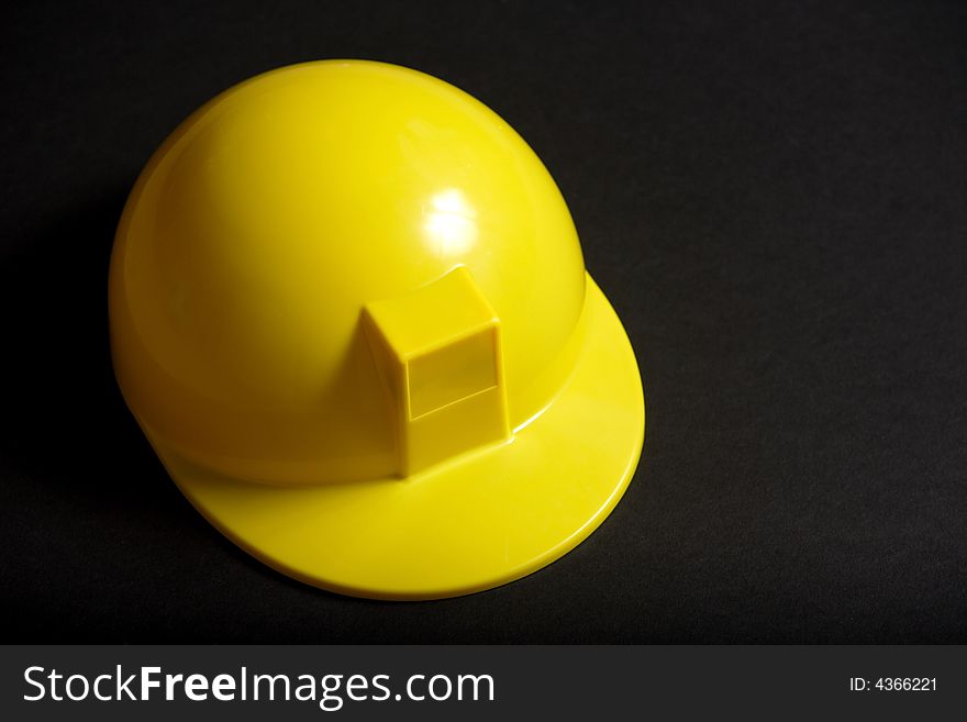 A yellow Hard Hat in the studio