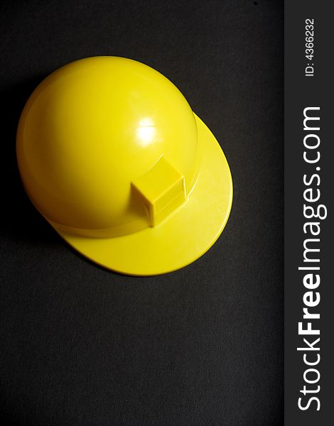 A yellow Hard Hat in the studio