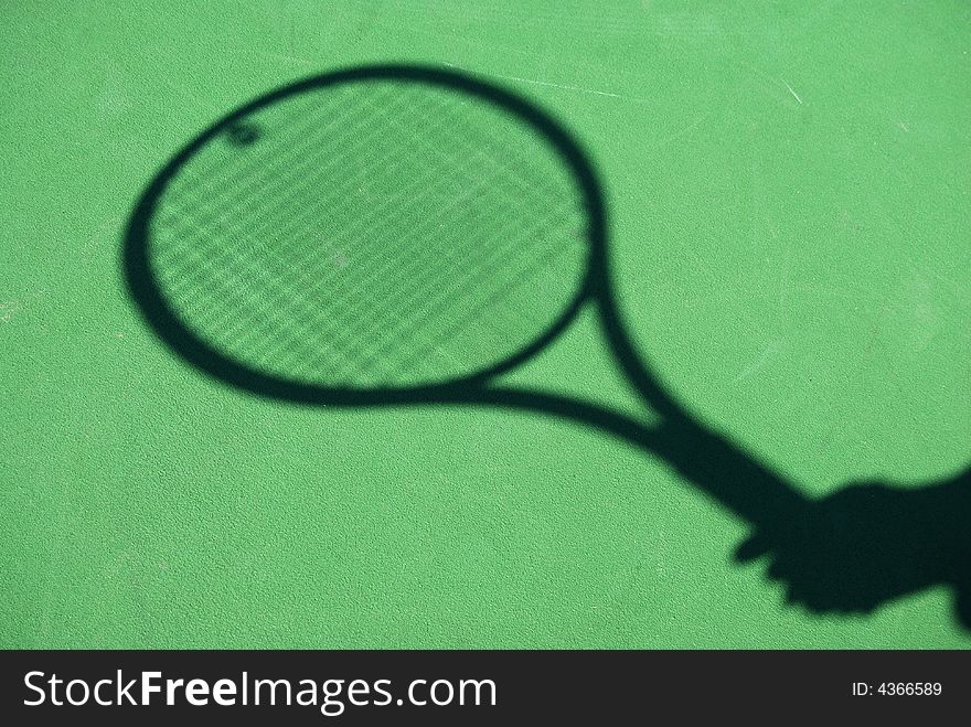 A shadow ofa tennis racket. A shadow ofa tennis racket