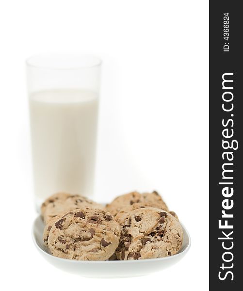 Delicious chocolate chip cookies and glass of milk isolated on a white background