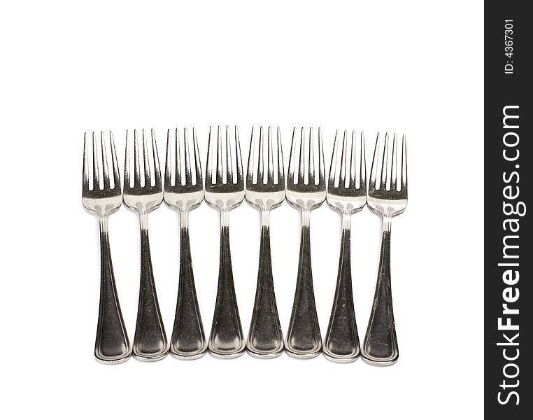 Row of classic steel kitchen forks