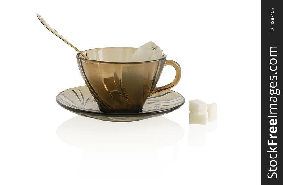 Cup with spoon, sugar anf package tea