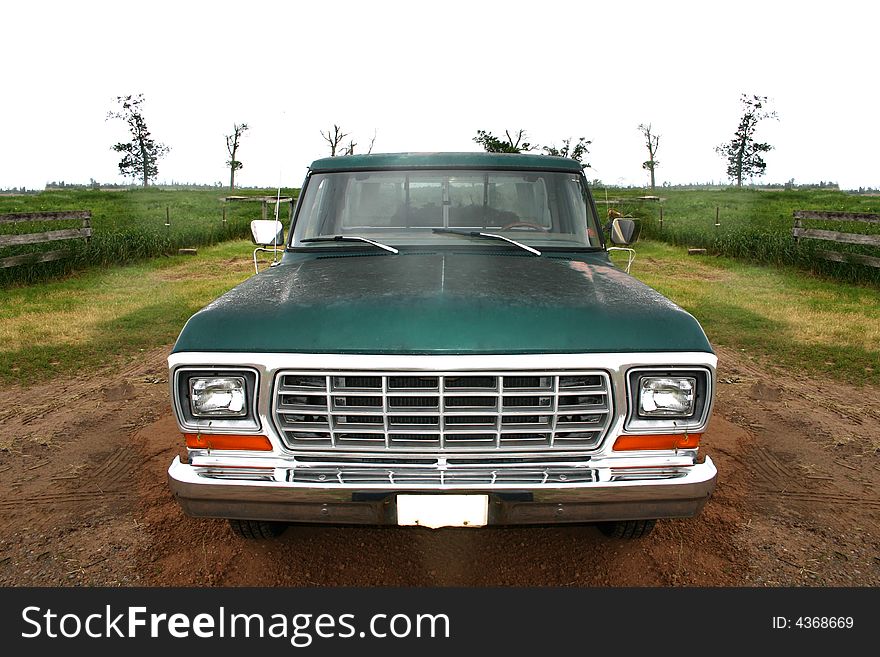 An old truck drive down a back road. An old truck drive down a back road