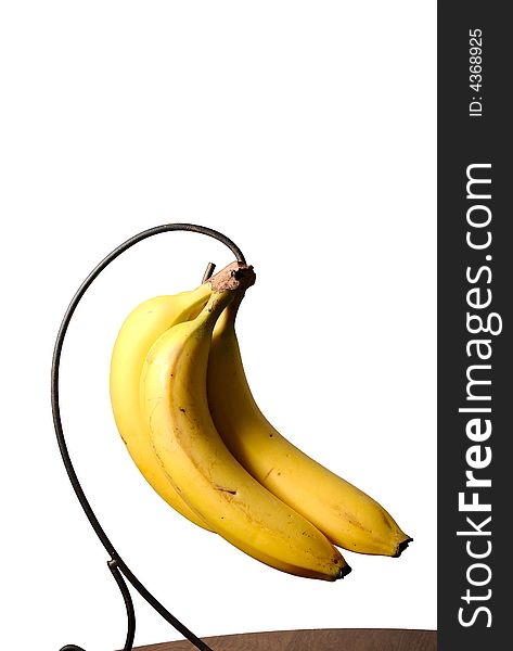 Bananas hanging in a bunch on white isolated background. Bananas hanging in a bunch on white isolated background.