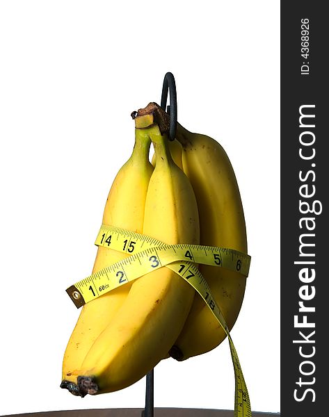 Measuring tape around a bunch of Bananas. Measuring tape around a bunch of Bananas.