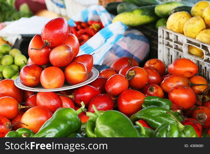 Fresh fruit and vegetables piled high at the local market. Fresh fruit and vegetables piled high at the local market