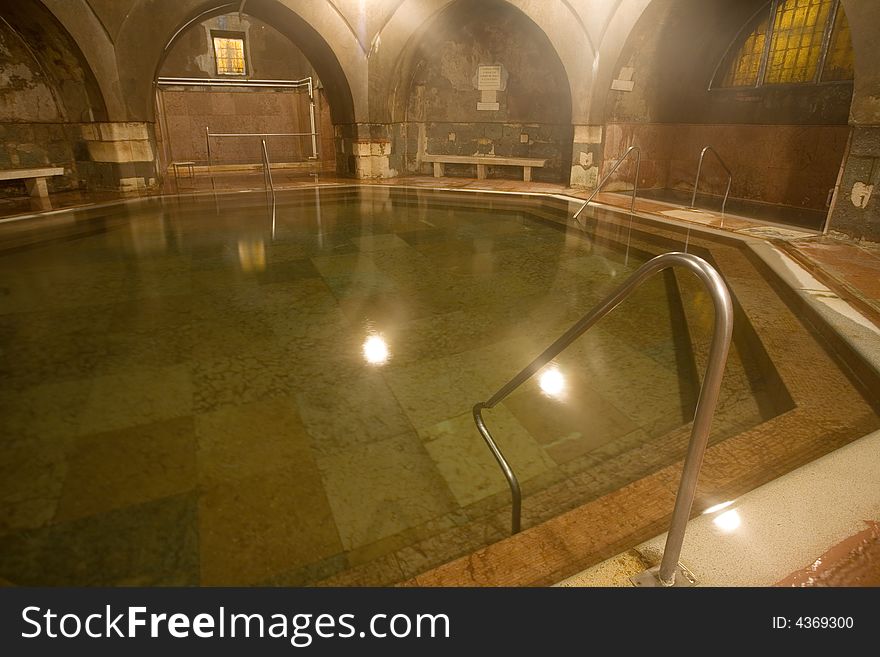 Old public baths interior with marble