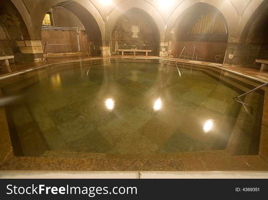 Old public baths interior with marble