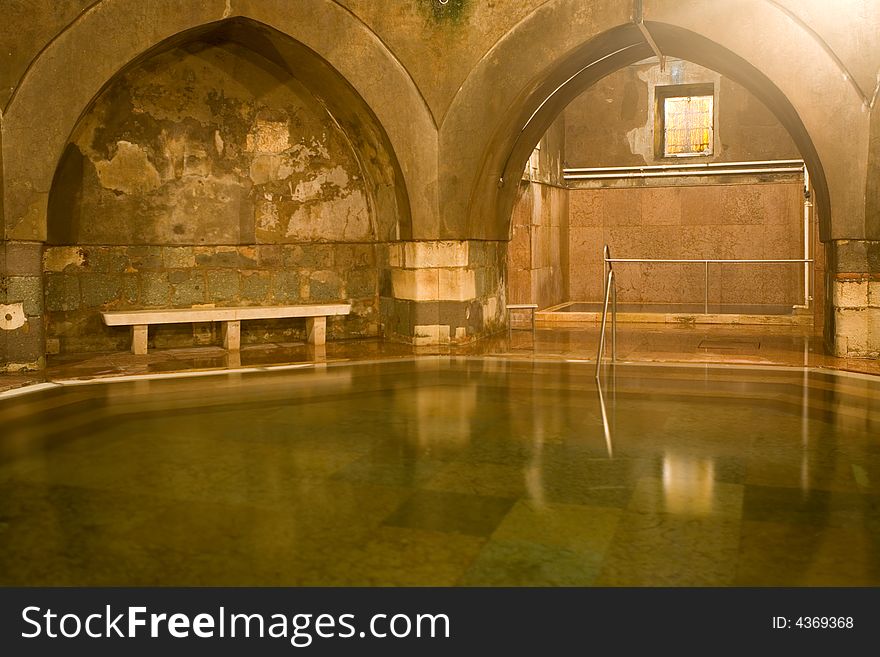 Old public baths interior with marble