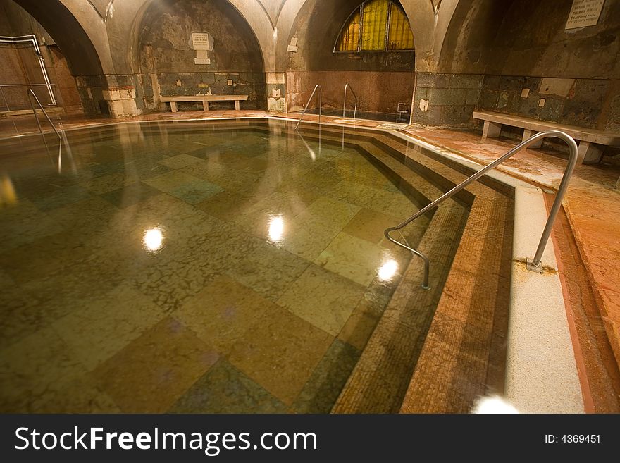 Old public baths interior with marble