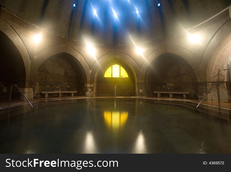 Old public baths interior with marble