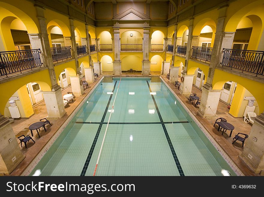 Elegant public baths interior, yellow walls