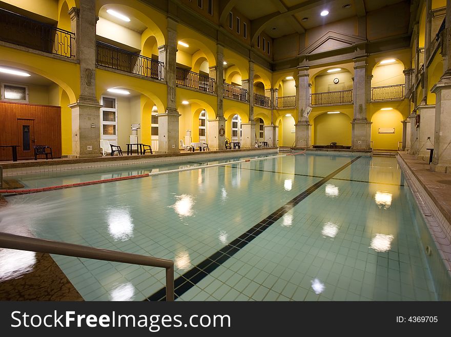 Elegant public baths interior, yellow walls