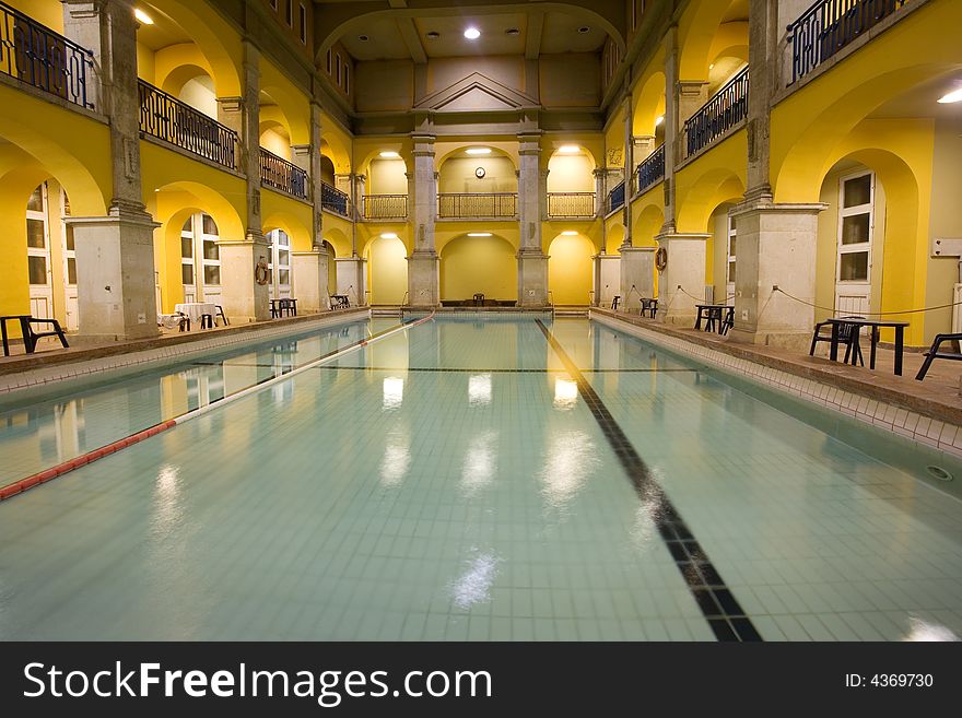 Elegant public baths interior, yellow walls