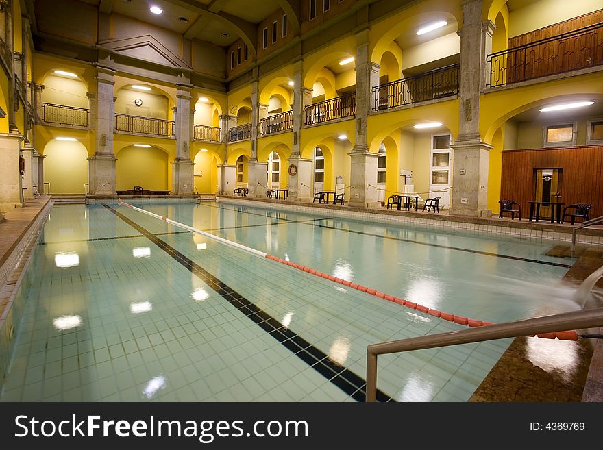 Elegant public baths interior, yellow walls