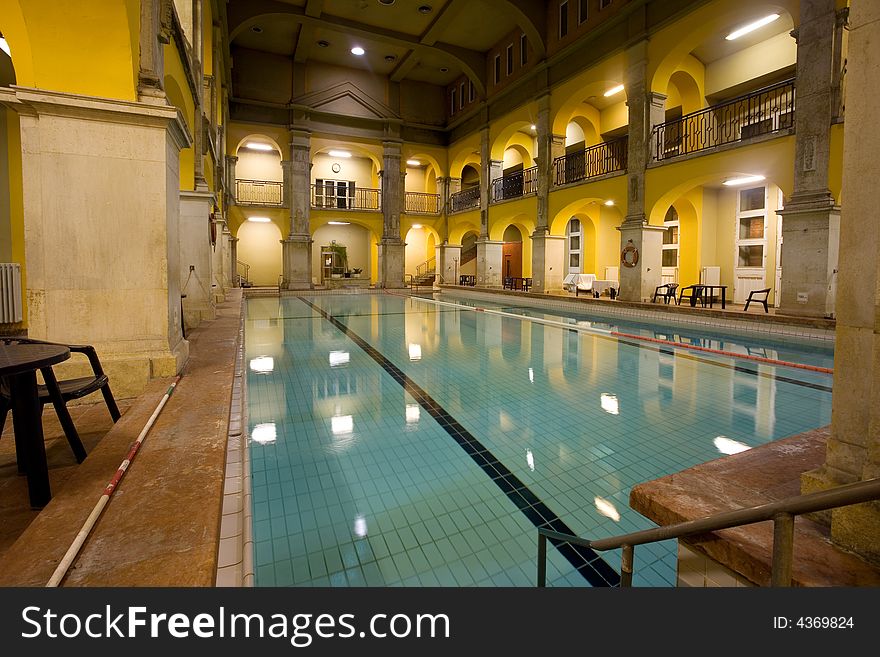 Elegant public baths interior, yellow walls