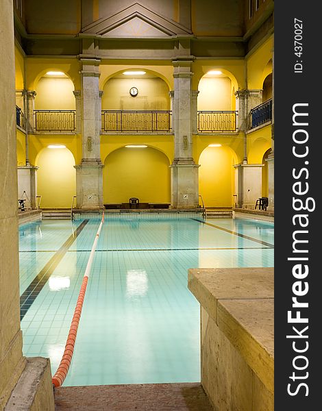 Elegant public baths interior, yellow walls