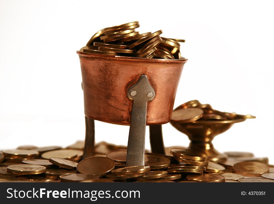 Image with many coins in two cups, and around them, symbolizing richness. Image with many coins in two cups, and around them, symbolizing richness.