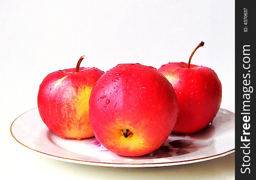 Red apples on a plate