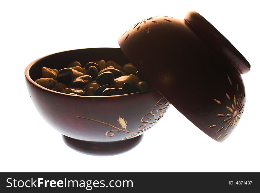 Ethnic wooden bowls whith pebbles