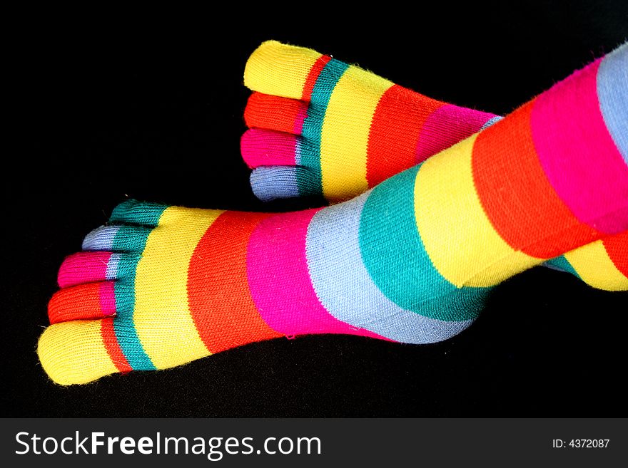 Fine multi-coloured шерстные socks on legs. Fine multi-coloured шерстные socks on legs