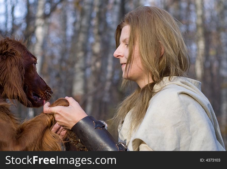 Portrait of the girl and irish setter in autumn forest. Portrait of the girl and irish setter in autumn forest.