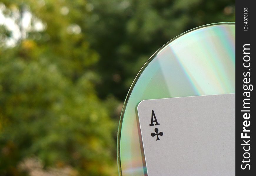 A piece of a cd and an ace. A piece of a cd and an ace