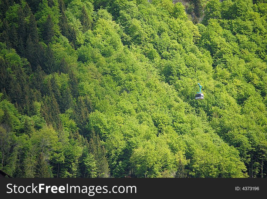 A revolving cablecar rotair is climbing along the mount titlis, switzerland. A revolving cablecar rotair is climbing along the mount titlis, switzerland.