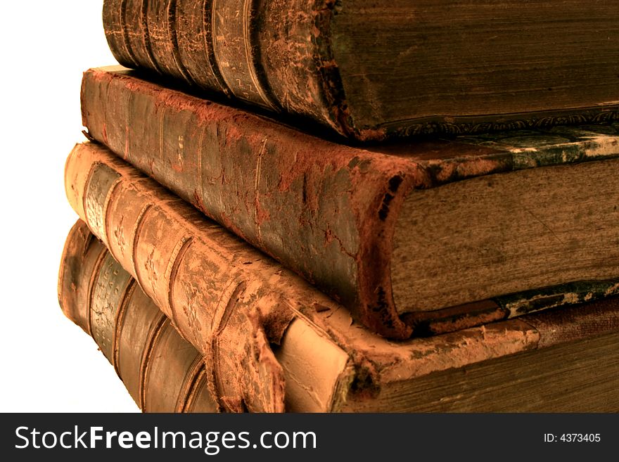 Vintage books stacked atop one another. Vintage books stacked atop one another.