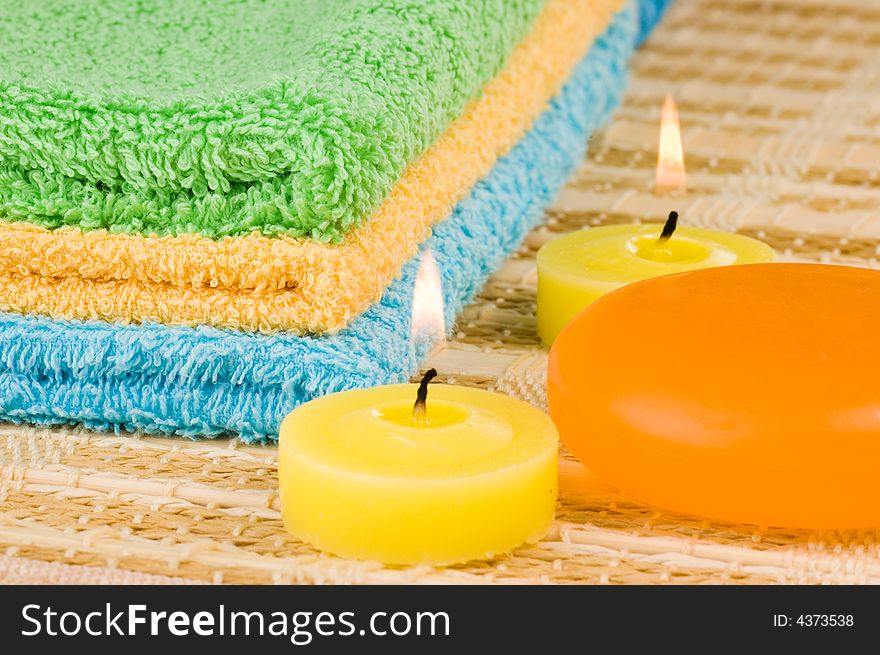 Towels soap and candles as spa conception. Towels soap and candles as spa conception