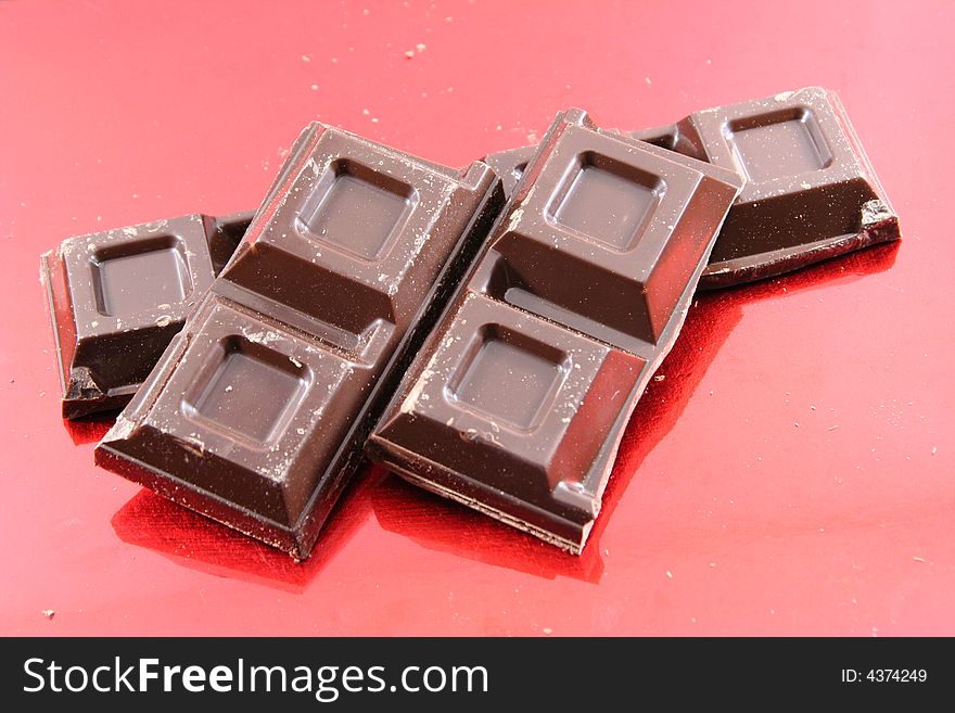 Chocolate isolated on a red background