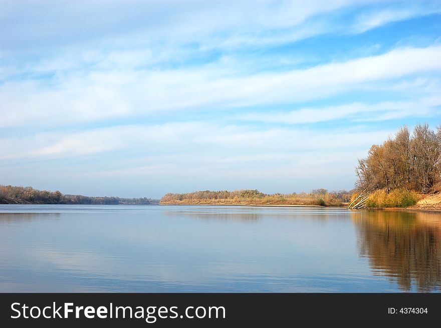 River on plain, water and sky