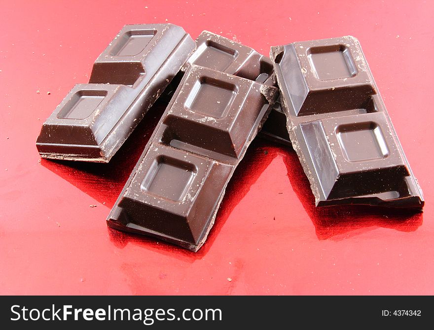 Chocolate isolated on a red background