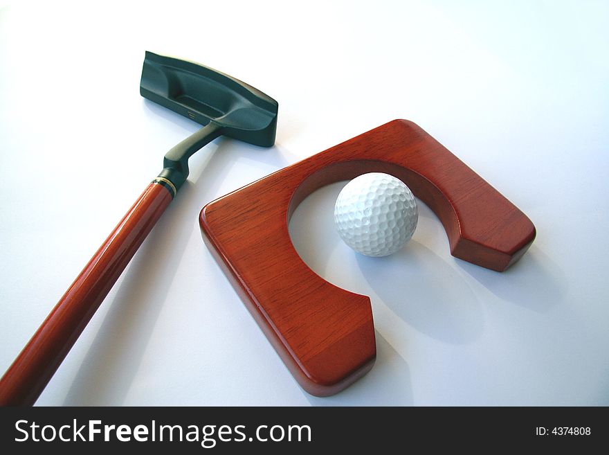 Golf club and a ball on white background. Golf club and a ball on white background.