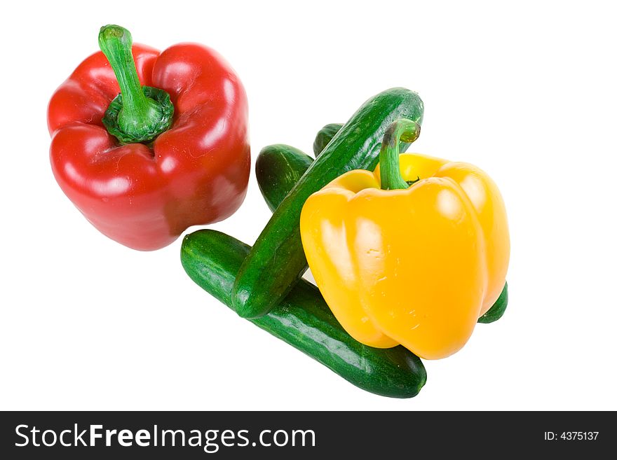 The two pepper and cucumbers isolated on a white background