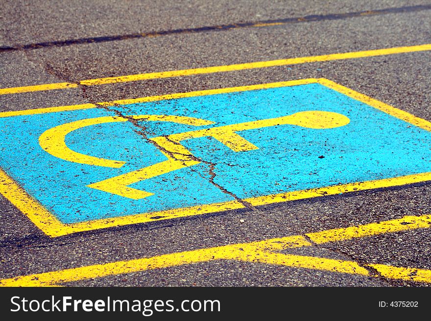 Blue and yellow handicapped parking space