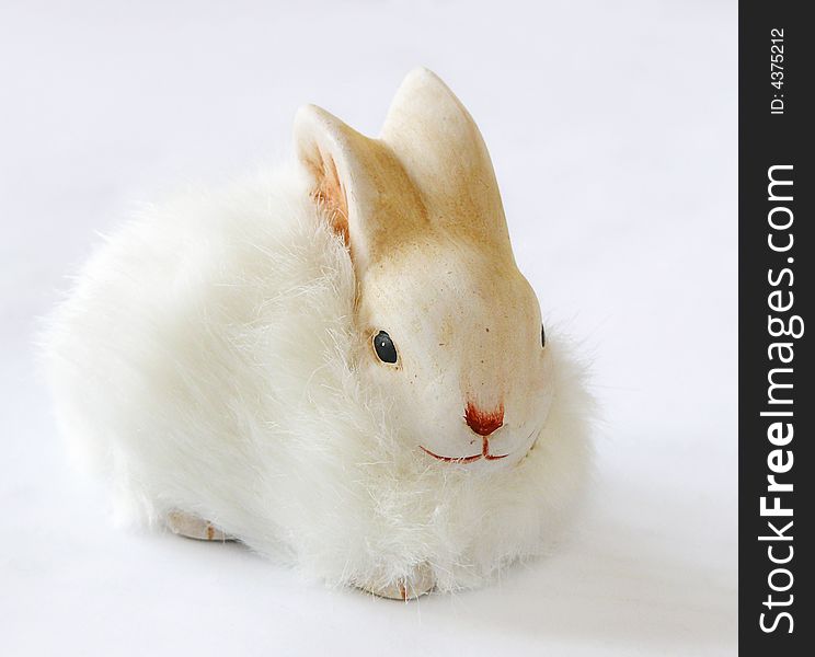 Little white easter rabbit on gray background. easter decoration