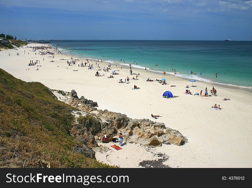 Beautiful sandy beach with many tourists.  Australia. Beautiful sandy beach with many tourists.  Australia.