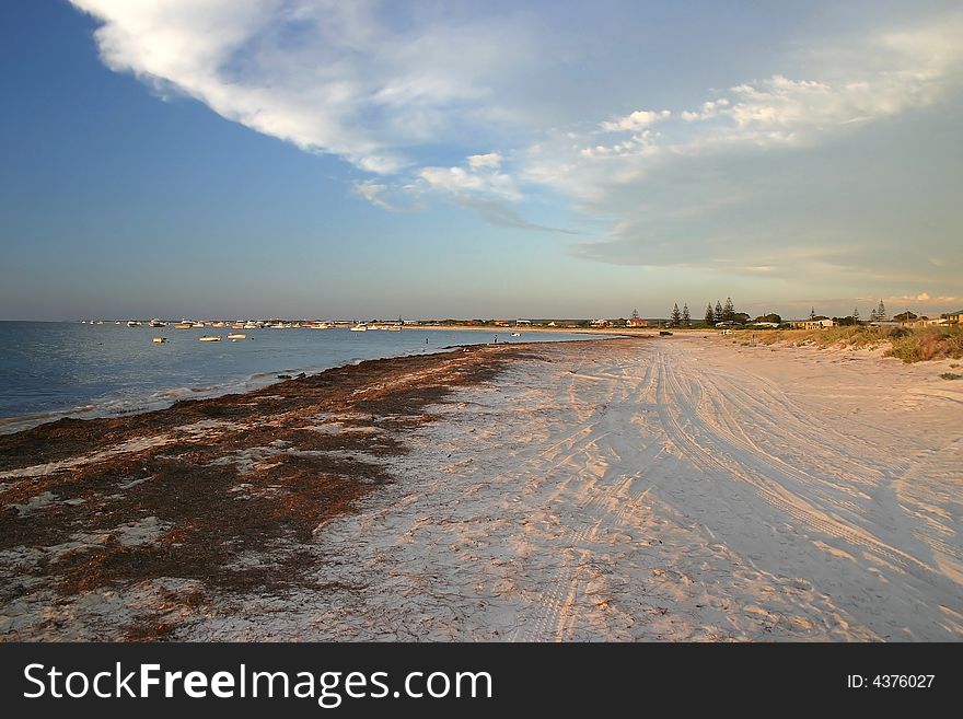 Sandy beach colored with late afternoon sunlight. Australia. Sandy beach colored with late afternoon sunlight. Australia.
