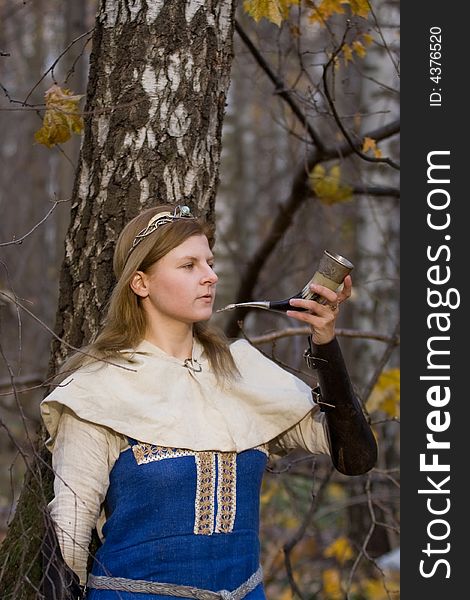 Portrait of the romantic girl in autumn forest. Portrait of the romantic girl in autumn forest