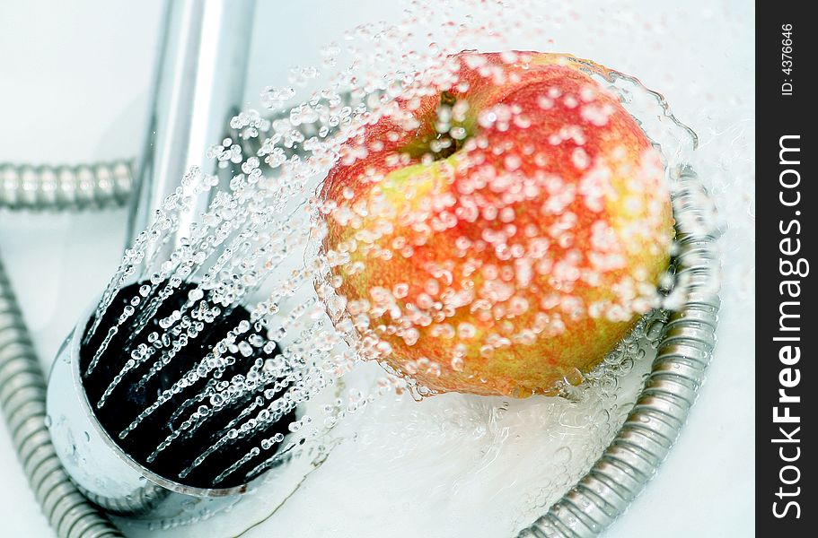 Close-up of an apple, drops and shower