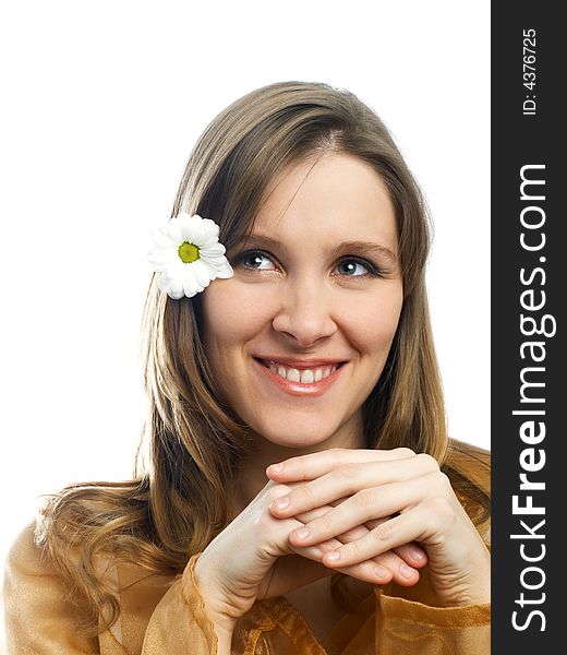 Smiling girl with daisy at hair on white background. Smiling girl with daisy at hair on white background