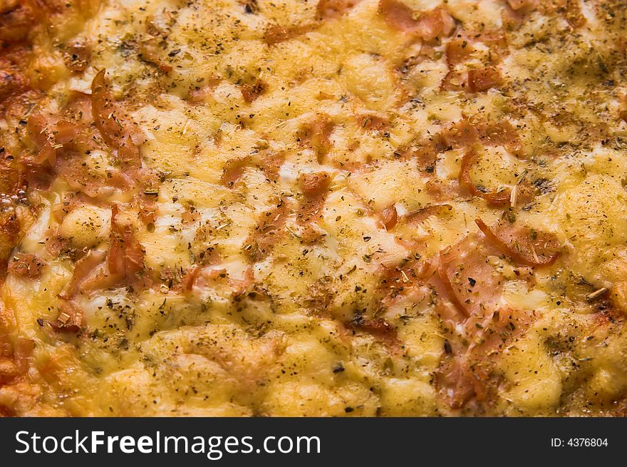 Fresh pizza with cheese and ham