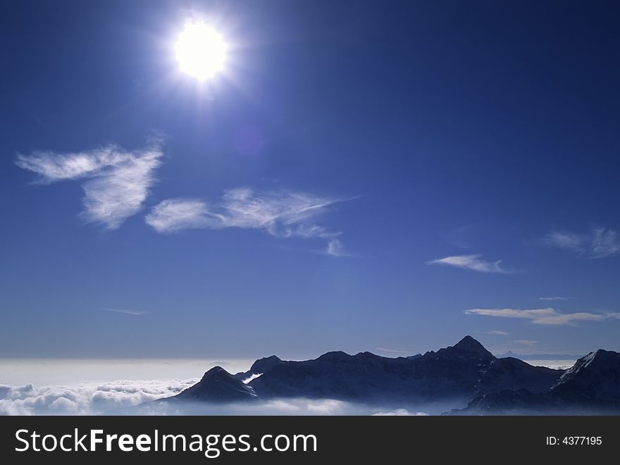 Mountain landscape in back-light; west Alps, Italy. Mountain landscape in back-light; west Alps, Italy