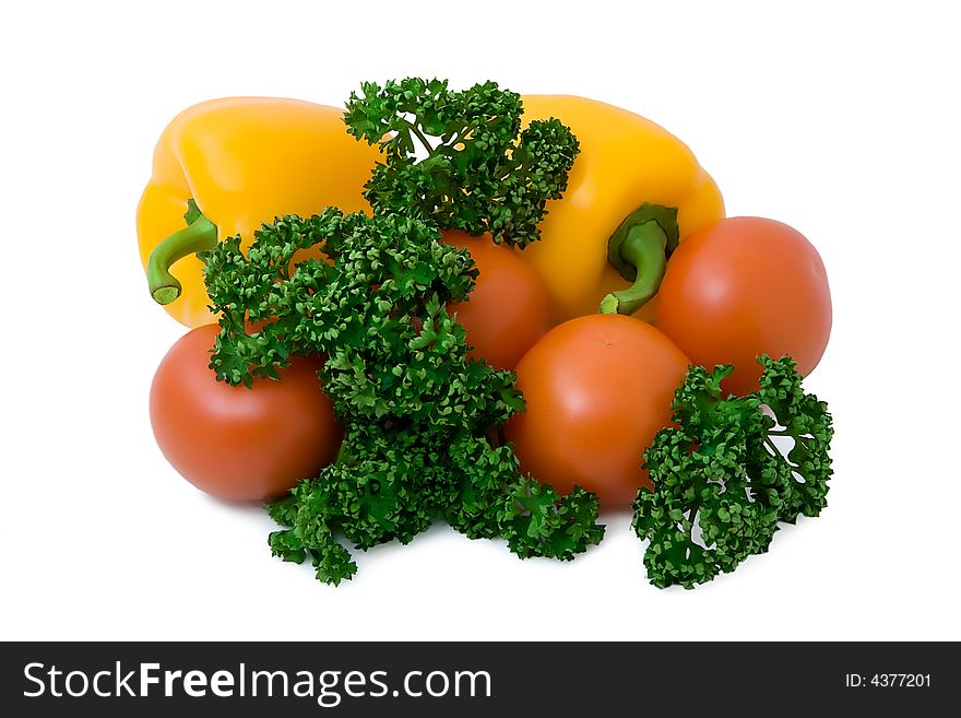 Isolated tomatoes pepper a parsley a close up. Isolated tomatoes pepper a parsley a close up