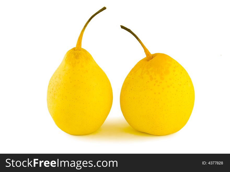 Two isolated yellow pears a close up