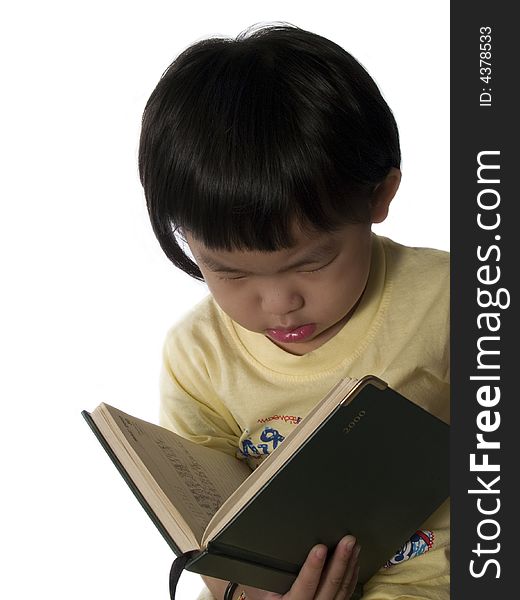 Little asian or Chinese girl reading book