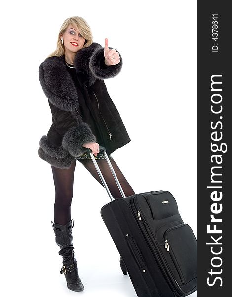 Beautiful blonde with valise on black background