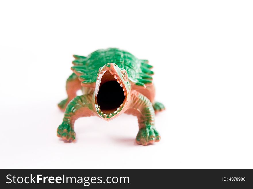 Single dinosaur reptile toy macro white background jaws
