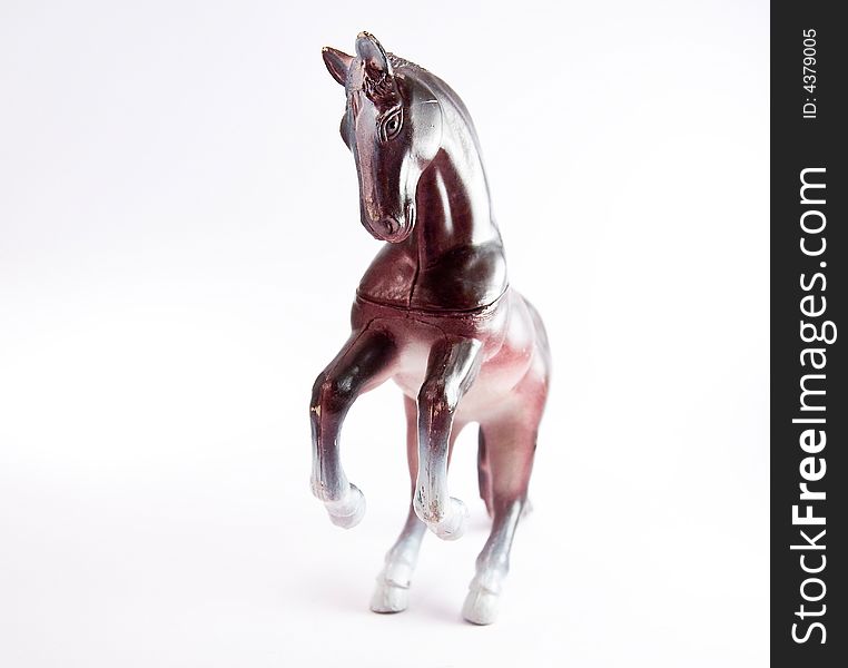 Single horse toy figure white background macro